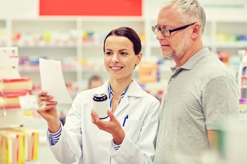 Pharmacist assisting a customer at the counter